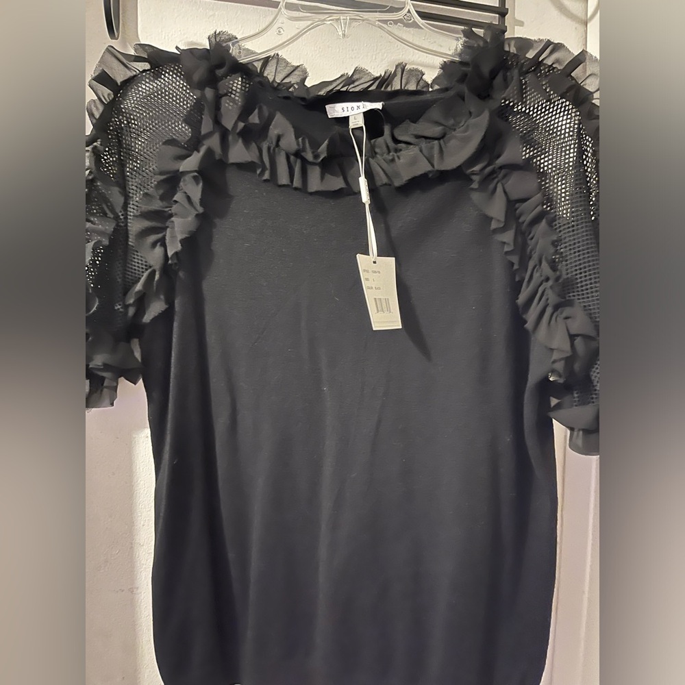 Sioni- size L- black top with cute ruffles and mesh detail. Worn once.
